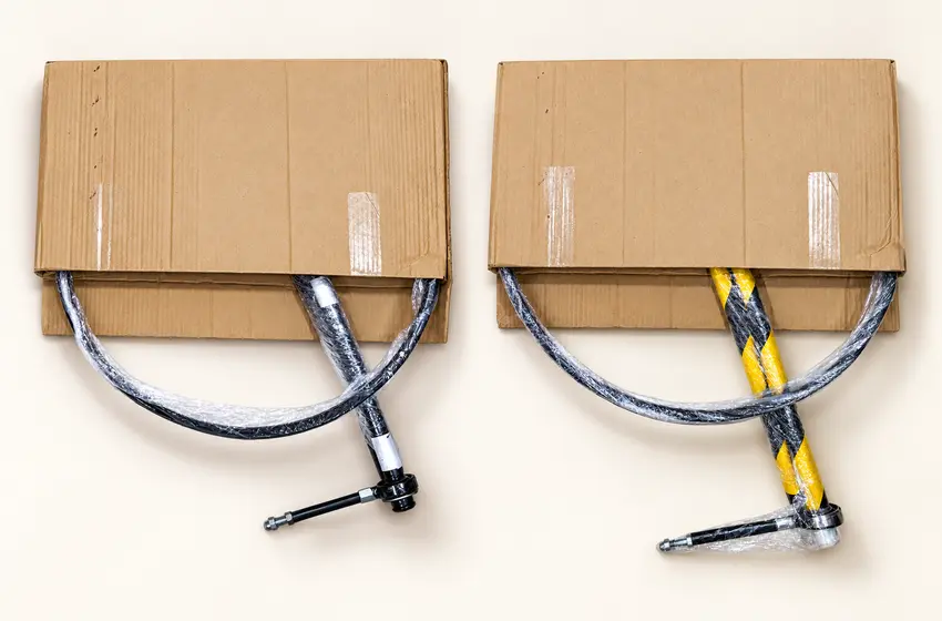 Packed black MS and yellow-and-black GI windsock stands with wrapped hoops and poles